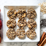 9 apple cinnamon bites on a white square plate.